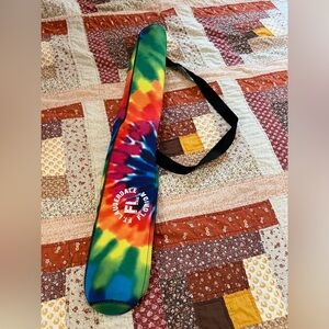 Insulated over shoulder beer can cooler.